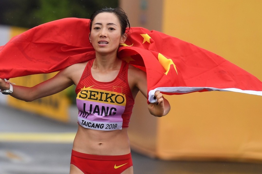 Liang Rui, of China, celebrates breaking the world record with her 50km racewalk victory in Taicang. Photo: Xinhua