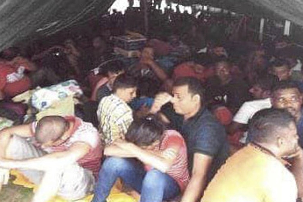 More than 120 Sri Lankans were discovered aboard a rusted tanker ship off Malaysia, as authorities busted an international smuggling ring. Photo: AP