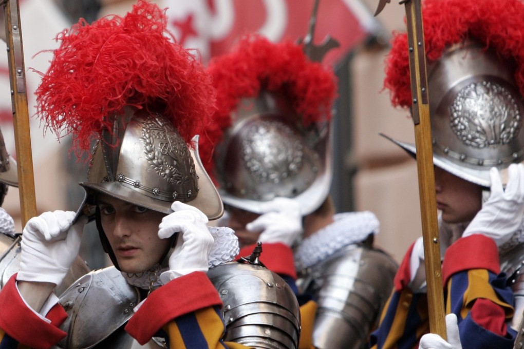 Swiss Guards hope to replace their existing metal helmets by next year if they can find sponsors to pay for the new ones. Photo: AP