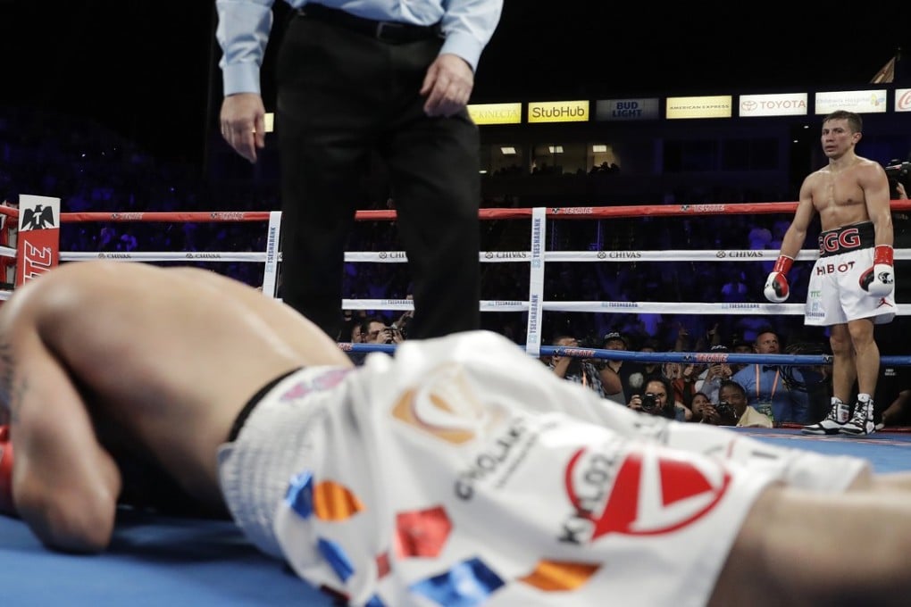 Gennady Golovkin waits in the corner while the referee counts out Vanes Martirosyan in their middleweight bout. Photo: AP