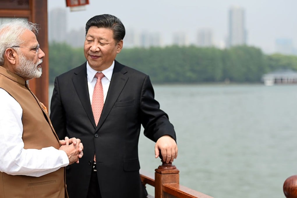 India's Prime Minister Narendra Modi and Chinese President Xi Jinping share a moment in Wuhan on April 28. Photo: AFP