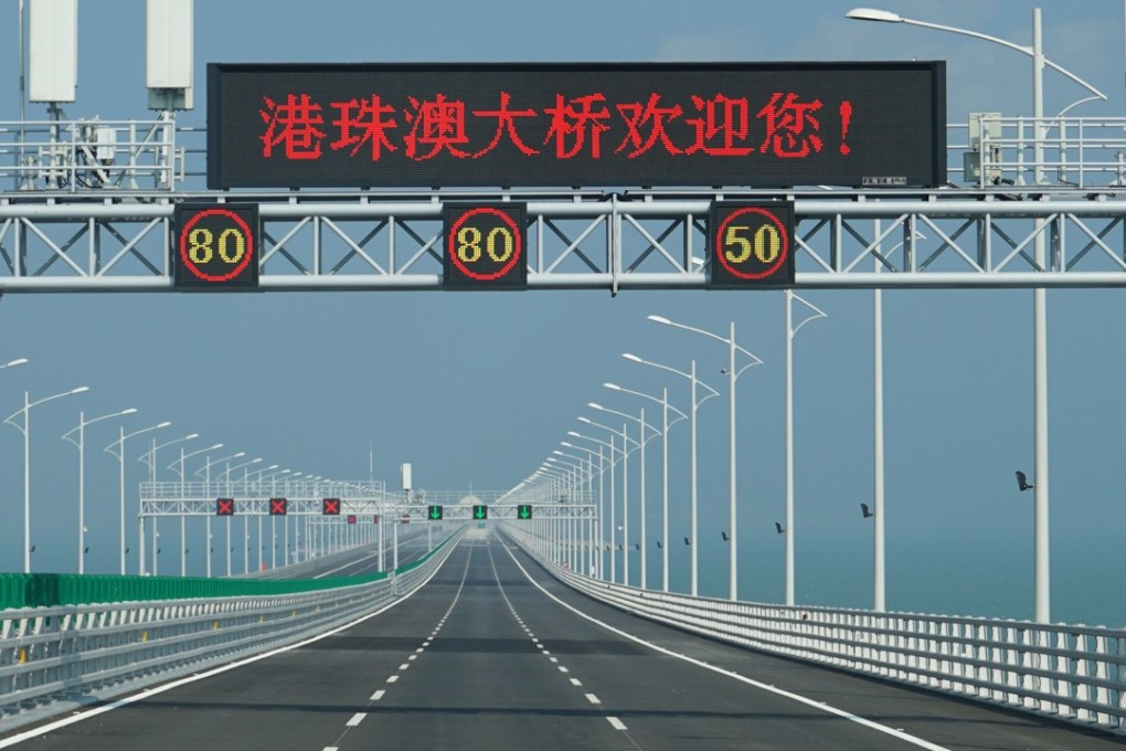 A sign welcomes drivers to the Hong Kong-Zhuhai-Macau Bridge on March 18. While Beijing has stepped up calls for airlines to stop treating Hong Kong as separate from China, documents issued in Hong Kong, such as driver’s licences, are not accepted on the mainland. Photo: Joshua Lee