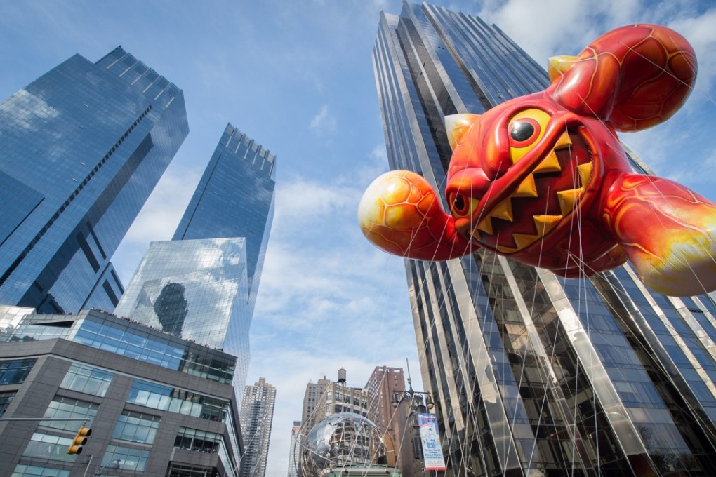 The Macy's Thanksgiving Day Parade moves through Columbus Circle in New York. Deutsche Bank’s new Midtown address will be One Columbus Circle, which is part of the complex at the 80-story, twin-towered Time Warner Center. Photo: AP