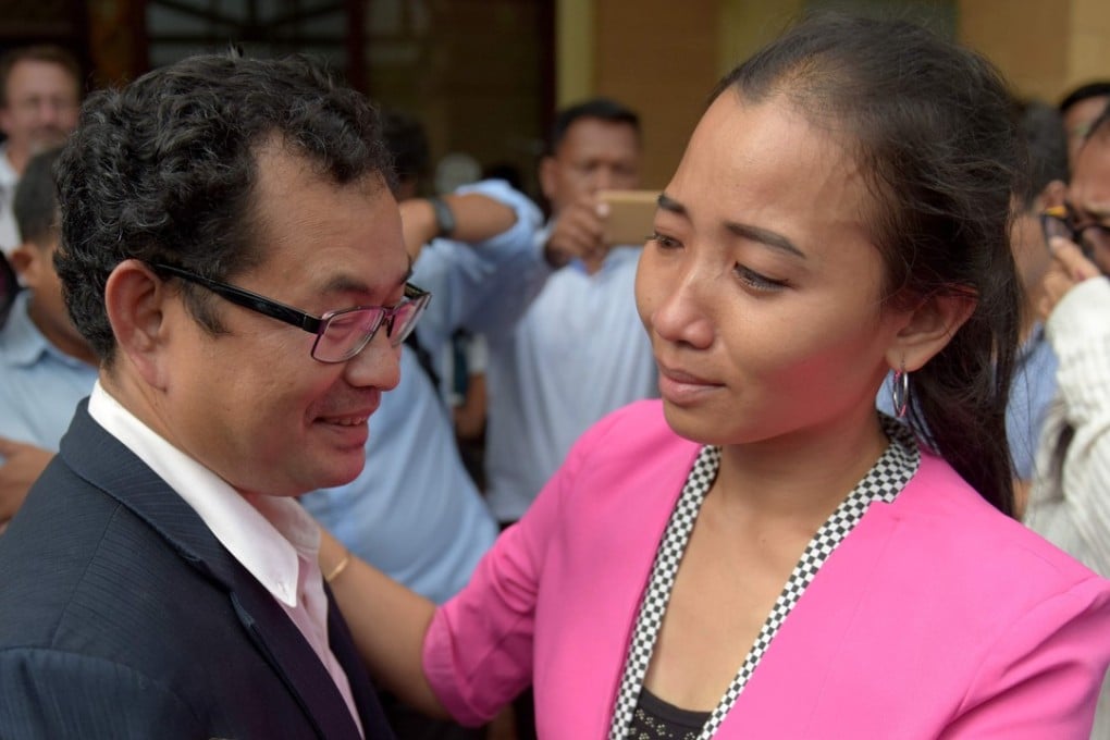 Kay Kimsong (left), who had worked at The Post for 10 years, said that the representative of the newspaper’s new owner had told him he made a big mistake by allowing the publication on the front page of the article saying a PR firm linked to the prime minister had bought The Post. Photo: AFP
