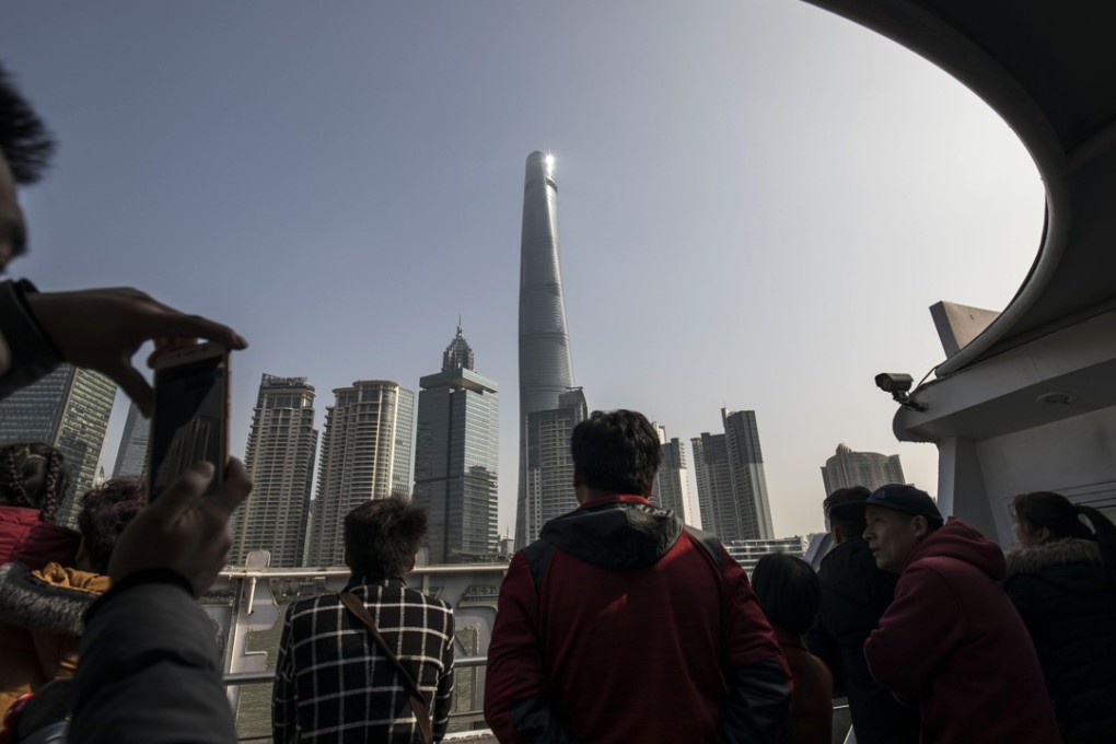 Tourists take a ferry ride on the Huangpu River in Shanghai, whose residents were China’s highest earners in the first three months of this year. Photo: Bloomberg