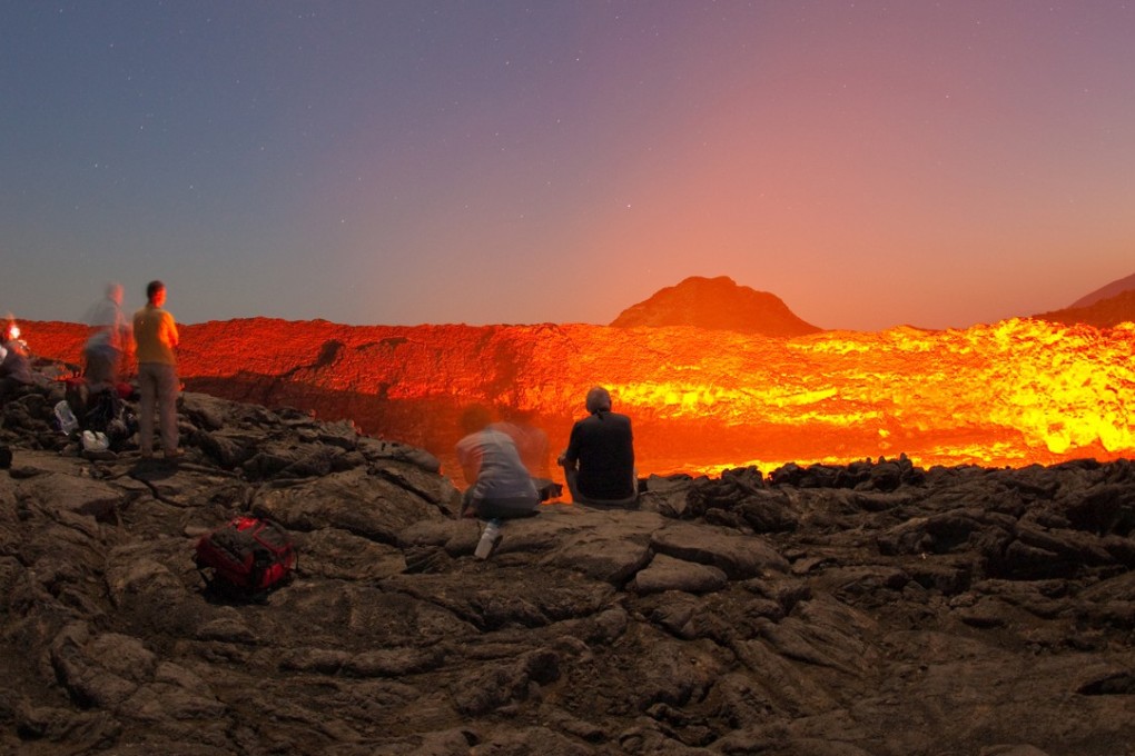 Sightseers get a good look at Erta Ale, Ethiopia’s most active volcano. Photo: Volcano Adventures