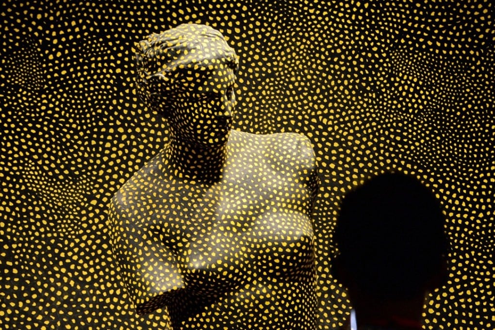 Yayoi Kusuma’s “Statue of Venus Obliterated by Infinity Nets No. 2”. Picture: AFP