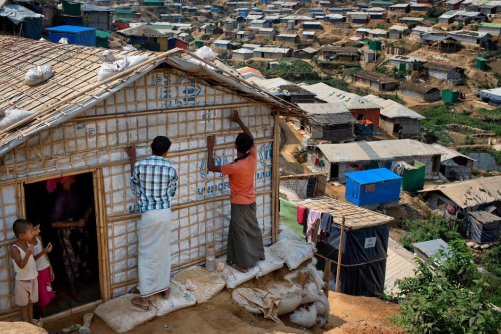 Rohingya refugees rebuild their makeshift house, in preparation for the approaching monsoon season at the Kutupalong Rohingya refugee camp in Kutupalong, Bangladesh on April 28. Photo: AP
