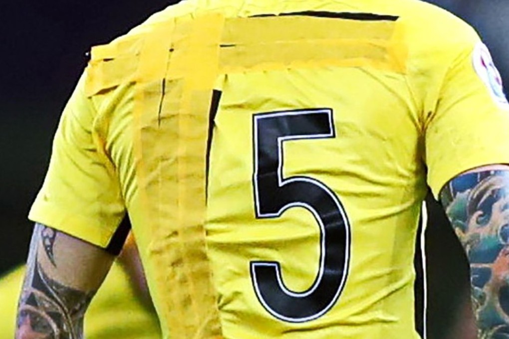 Guangzhou Evergrande’s Zhang Linpeng wears a number 15 jersey with the number 1 covered by tape. Photo: AFP