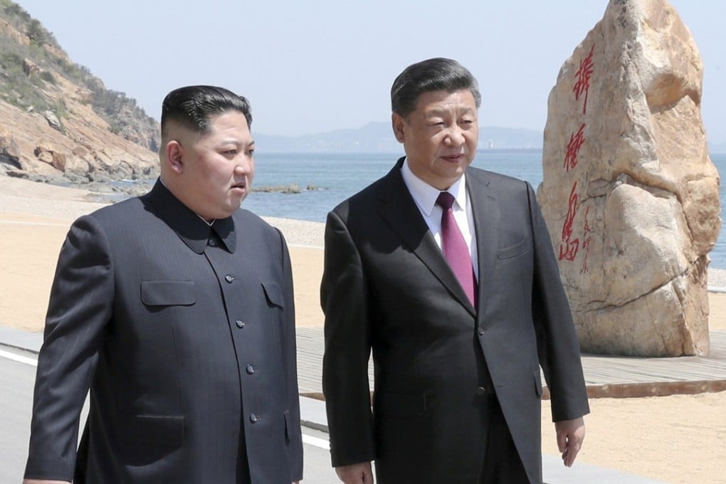 Chinese President Xi Jinping, right, and North Korean leader Kim Jong-un in Dalian, China, on Tuesday. The meeting between the two, the second in a matter of weeks, is a reminder of the crucial role China will play in any negotiations to denuclearise North Korea, US analysts said. Photo: Xinhua via Reuters
