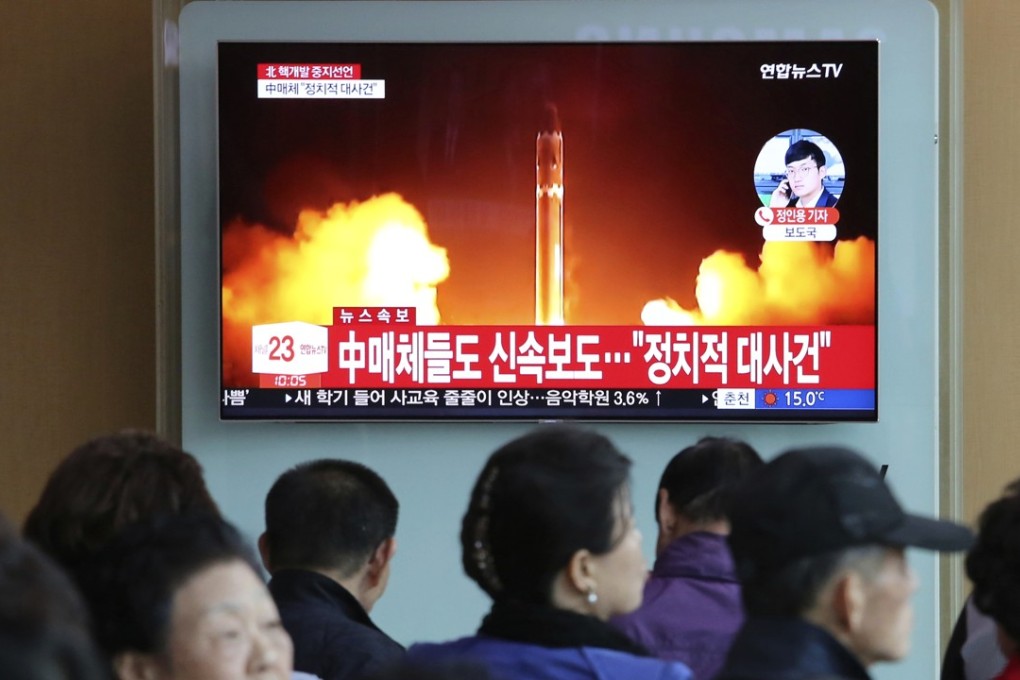 People at a railway station in Seoul, South Korea, watching a television programme showing file footage of a North Korean missile launch. Photo: AP