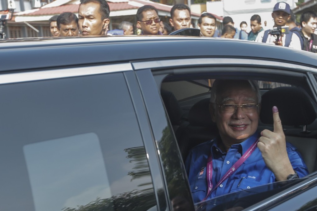 Malaysian Prime Minister Najib Razak after casting his vote. Photo: EPA