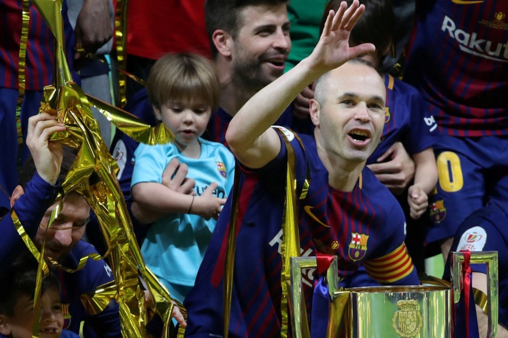 Andres Iniesta celebrates with the Copa del Rey trophy. Photo: Reuters