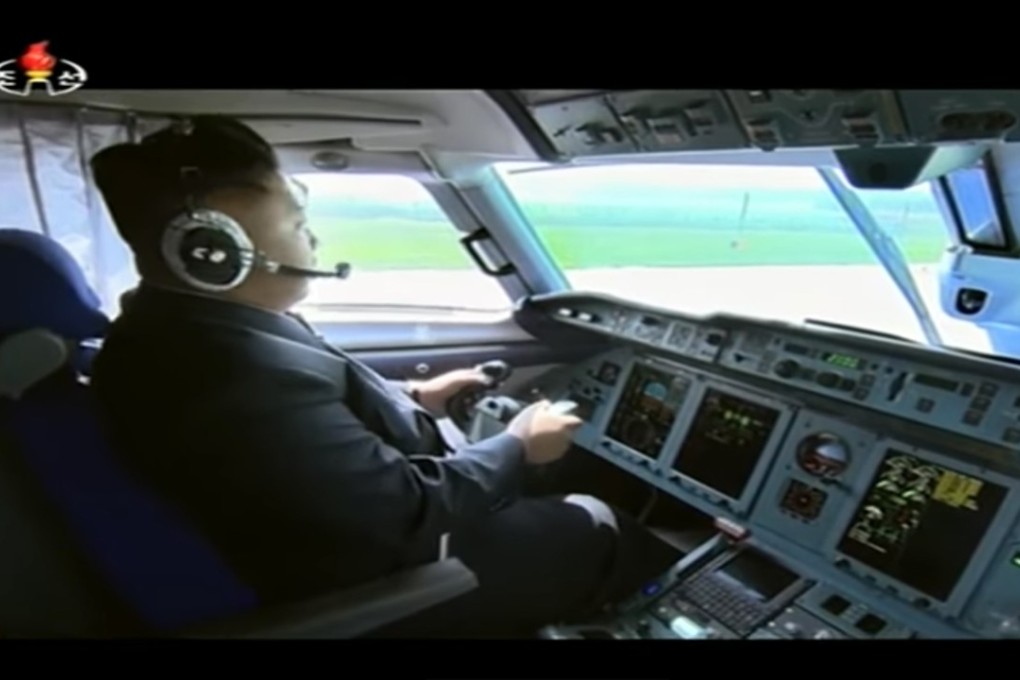 Kim Jong-un has been shown by state media at the controls of what may be his An-148. Photo: Handout