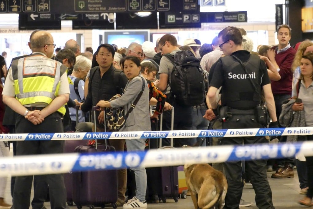 Police set up a safety perimeter at the Brussels train station where a small blast during the evening rush hour caused a brief panic on Wednesday. Photo: AP