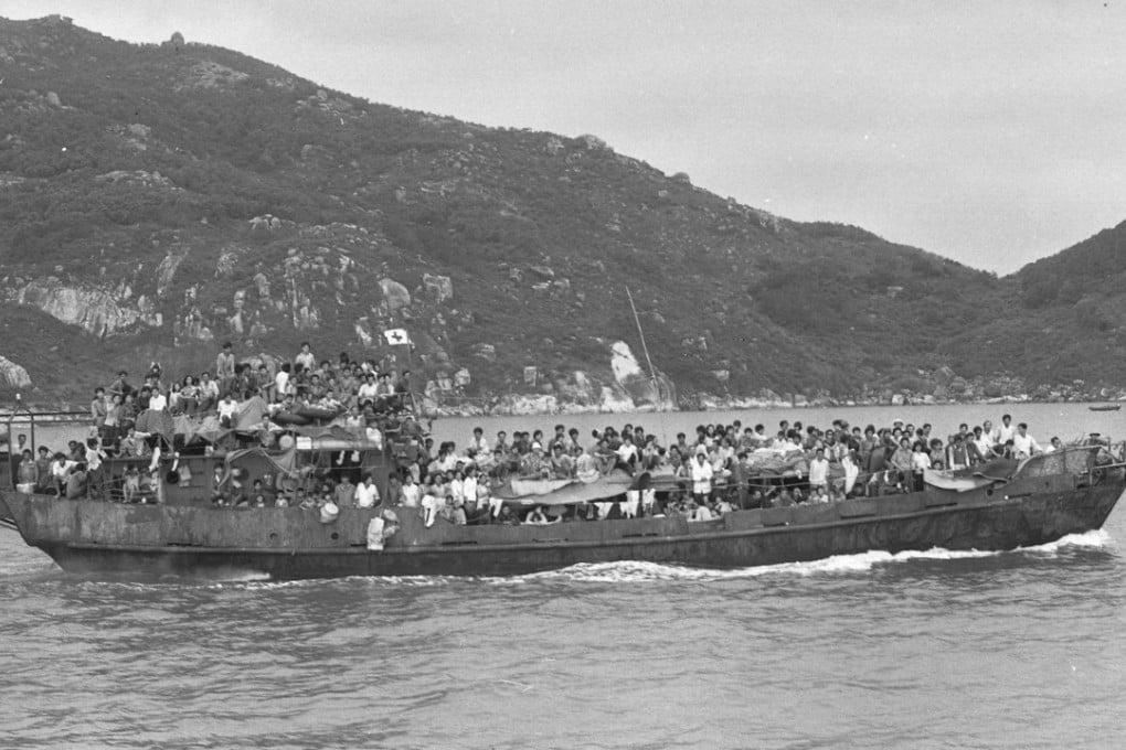 A rusting motorised barge sails into Hong Kong with its cargo of 329 Vietnamese refugees, in May 1979. Photo: SCMP