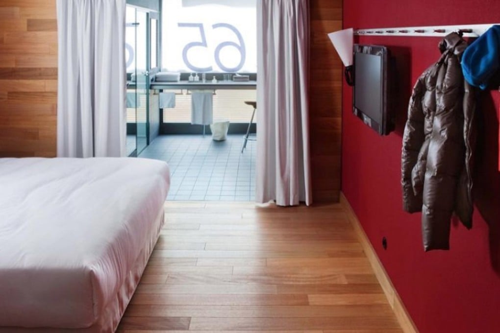 Warm woods and deep reds dominate the modern, minimalist interiors, while a quirky approach to amenities allows the Camper brand’s identity to shine through.