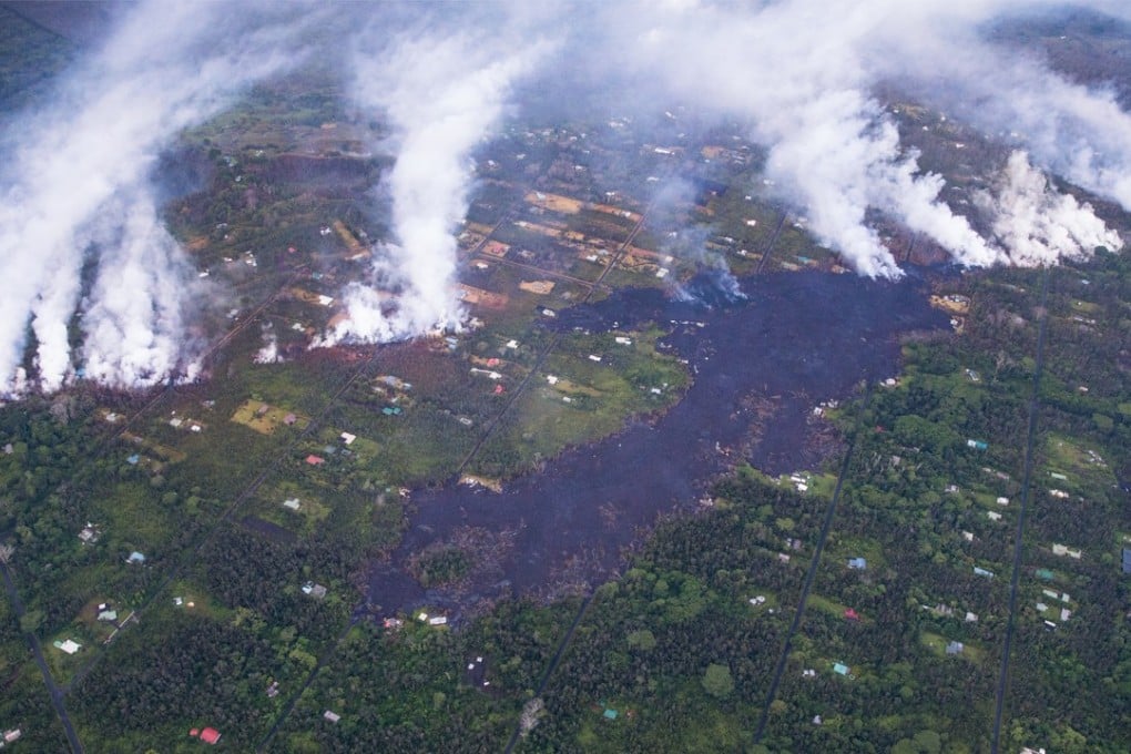 An aerial view shows smoke and burned areas as eruptions continued overnight within the Leilani Estates subdivision in Pahoa, Hawaii, on Wednesday. Experts say there is a risk that the volcano could suffer an explosive eruption, launching rocks the size of refrigerators miles into the air. Photo: EPA-EFE
