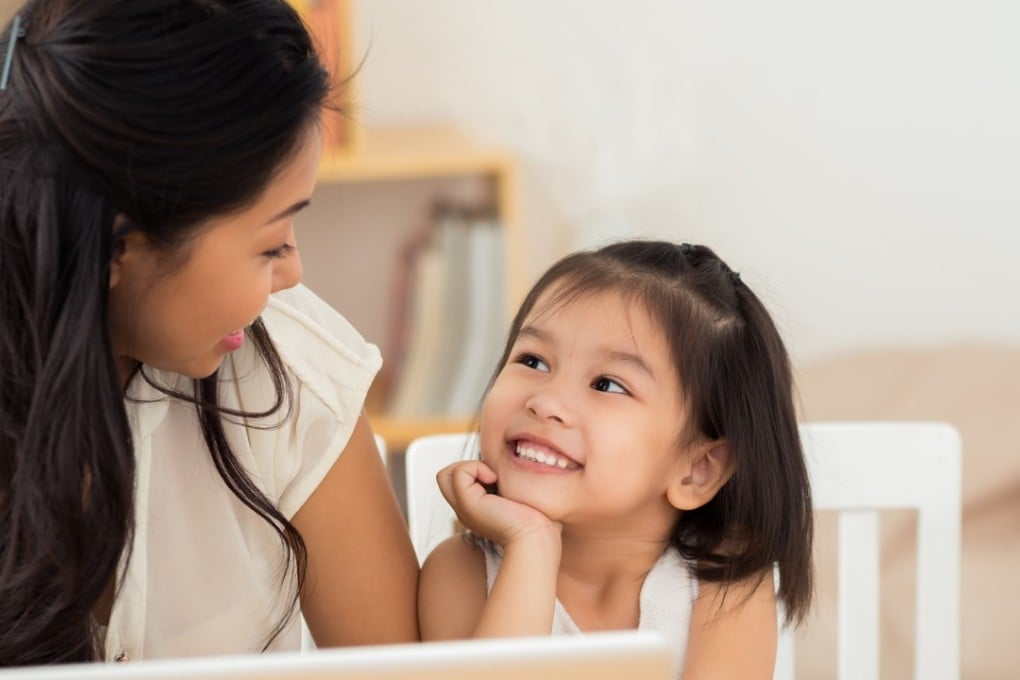Long working hours leave Hong Kong mothers with little time to spend with their children. Photo: Getty Images