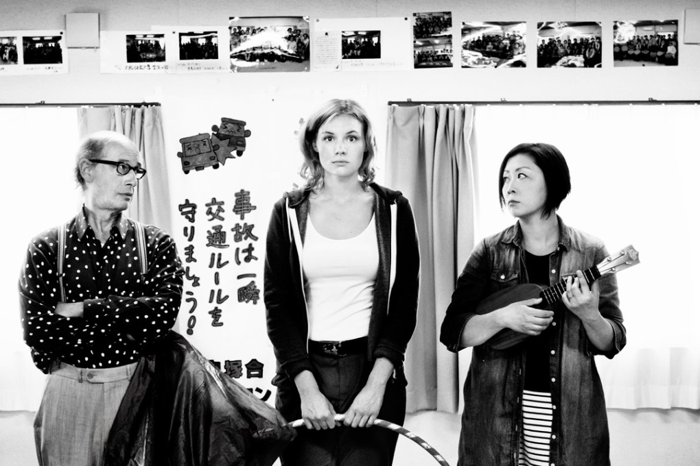 Rosalie Thomass (centre) in Greetings from Fukushima.