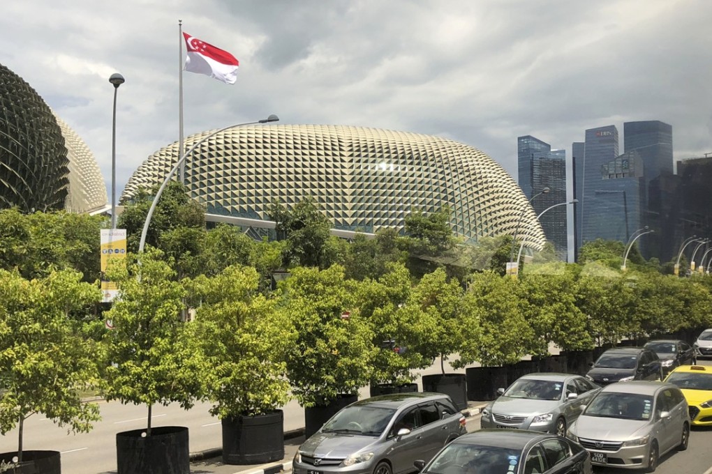 The national flag of Singapore flies against the financial skyline along the edge of the Singapore River on Thursday. US President Donald Trump will meet with North Korea's leader Kim Jong-un in Singapore on June 12. Photo: AP