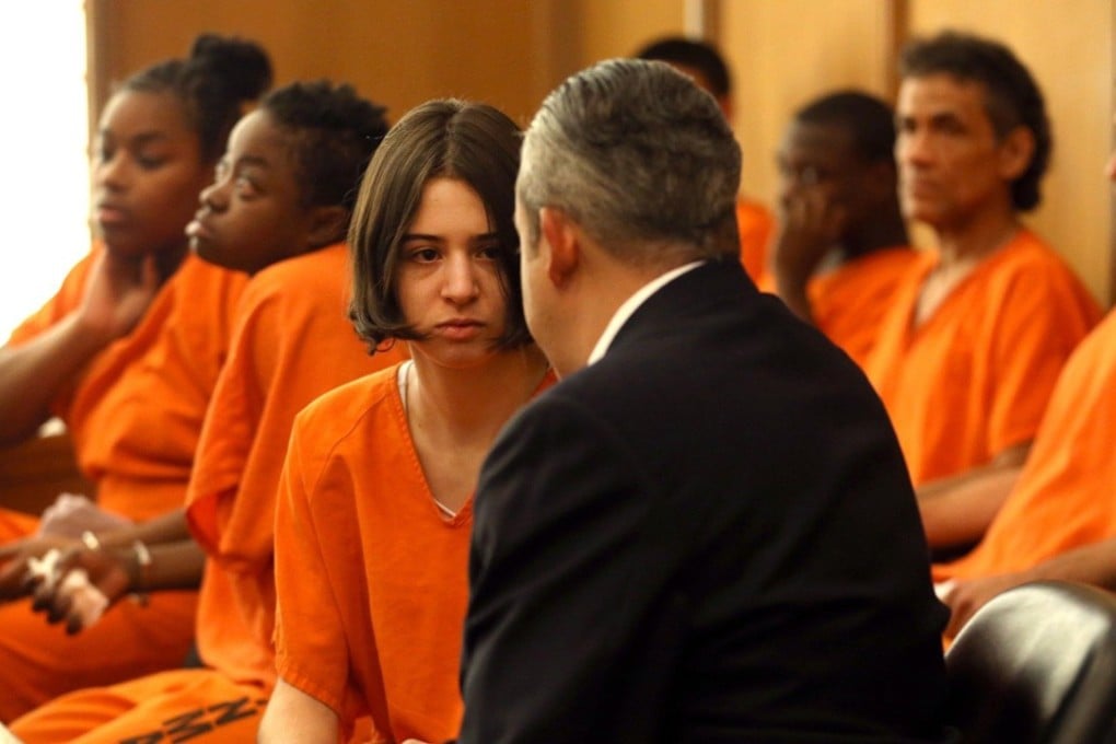Marta San Jose consults with her lawyer Jorge L. Viera at her arraignment on July 27, 2017. San Jose is a former foreign-exchange student accused of helping her host, Dale Leary, abuse her own younger sister. She will face no charges. Photo: TNS