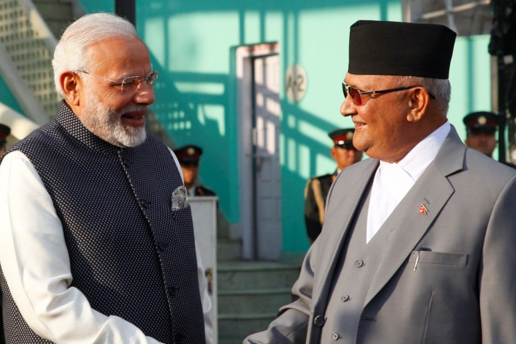 Indian Prime Minister Narendra Modi shakes hand with his Nepalese counterpart Khadga Prasad Sharma Oli. Photo: reuters