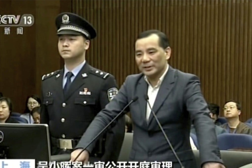 In an image taken from undated video footage run by China's CCTV, Wu Xiaohui, the former chairman of the Anbang Insurance Group, speaks during a court session in the Shanghai. He went on trial on March 28 on charges that he fraudulently raised $10 billion from investors and misused his position to enrich himself. Photo: CCTV via AP Video