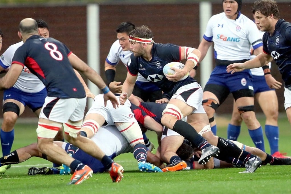 Hong Kong captain James Cunningham tries to find a way past the South Koreans in Incheon. Photo: Handout