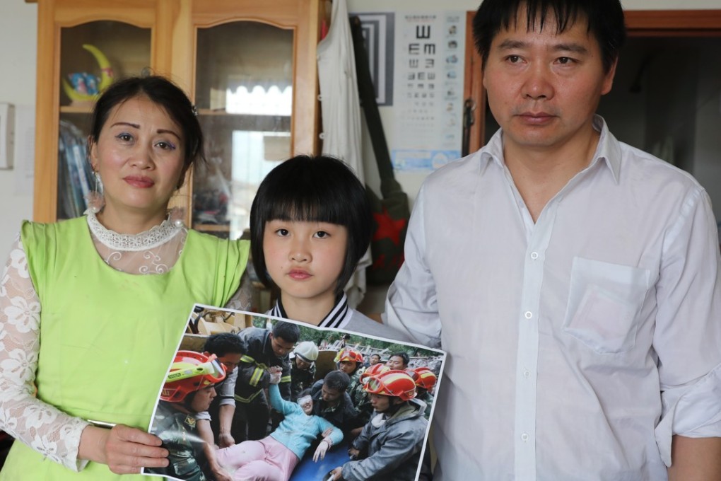 Zhang Xiaoyan, husband Pan Yuncheng, and their daughter Pan Xiaoai recall the miraculous circumstances of Zhang’s rescue and Xiaoai’s birth in the aftermath of the Sichuan earthquake in Dujiangyan a decade ago. Photo: Simon Song