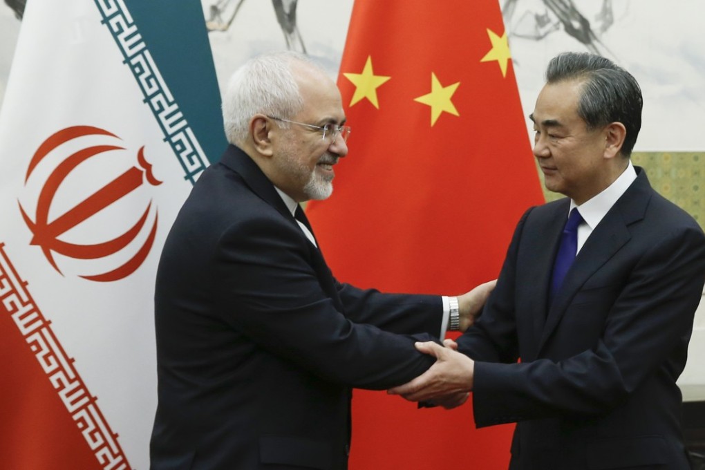 Iranian Foreign Minister Mohammad Javad Zarif meets his Chinese counterpart Wang Yi in Beijing on Sunday. Photo: EPA-EFE