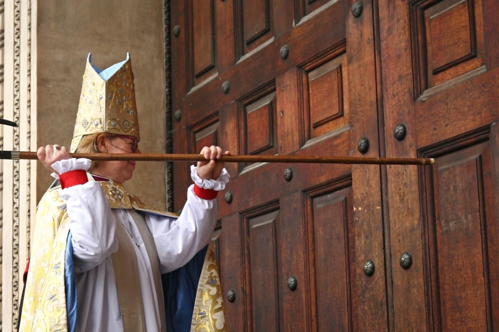 Sarah Mullally bangs on the door with her crosier during a ceremony to install her as the 133rd Bishop of London. Photo: AFP
