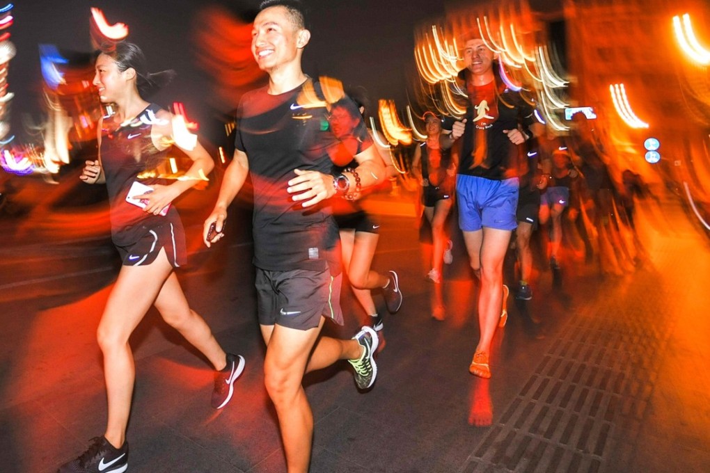 People running at night in Shanghai. About five million runners took part in more than 1,000 competitive events in China last year, roughly double the number in 2016. Photo: AFP