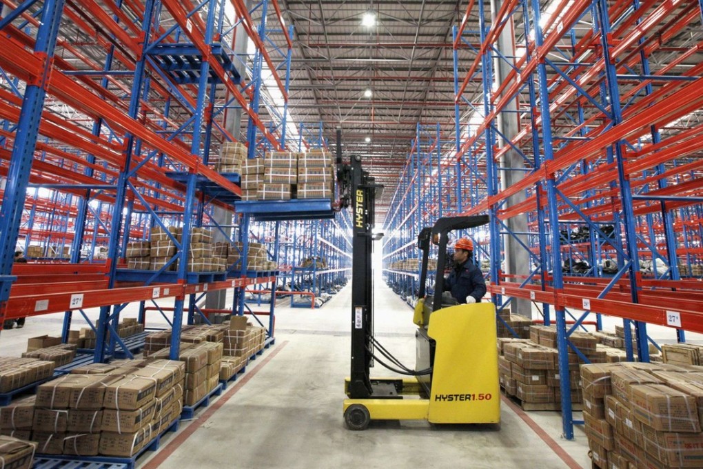 An employee works at a logistic center in Huaibei, Anhui province. Global Logistic Properties’ new private equity fund will be its first to invest in a sector other than real estate. Photo: Reuters