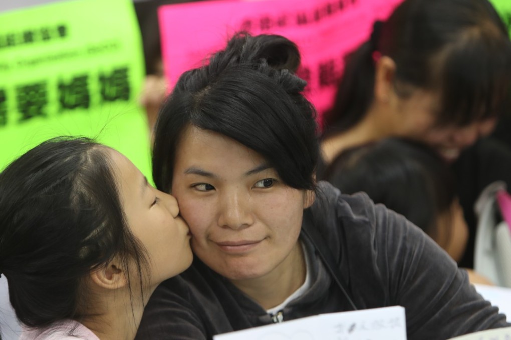 A mother and daughter as the Society of Community Organisation announced results of a study on single-parent cross-border families in Hong Kong. Photo: Winson Wong