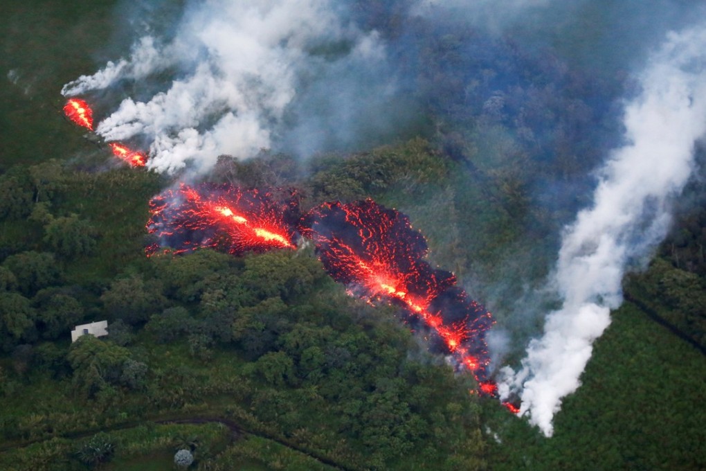 Lava erupts from a new fissure east of the Leilani Estates subdivision during ongoing eruptions of the Kilauea volcano in Hawaii on Sunday. Photo: Reuters