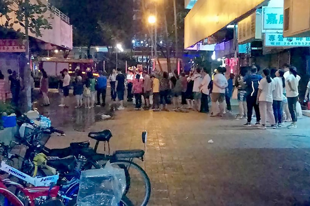 Residents of Garden Rivera in Sha Tin gather outside the estate in the early hours of Monday. Photo: Facebook