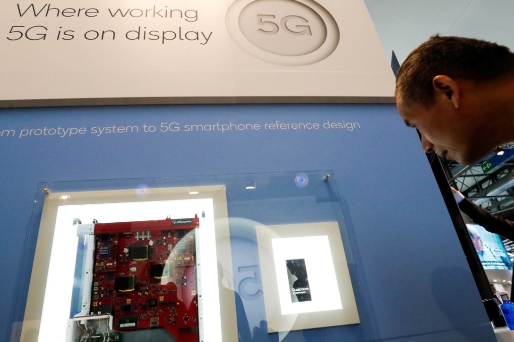 A display in the booth of Qualcomm shows the journey that early 5G smartphone chip sets have made out of its laboratory – starting as a suitcase full of outsize prototype components, which has been shrunk into a handset the size of a very thick chocolate bar – at Mobile World Congress in Barcelona in February this year. Photo: Reuters