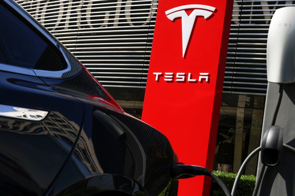 A Tesla car charges at a charging station in Beijing. Photo: Reuters