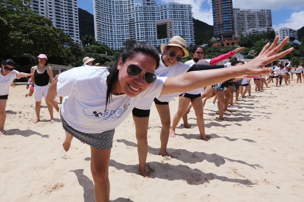 Splash Hong Kong graduates celebrate on Repulse Bay beach in June 2016. Photo: Edward Wong
