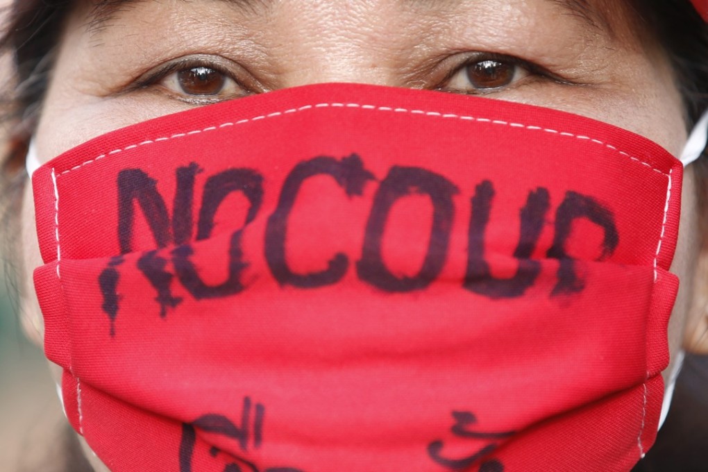 Thai pro-democracy supporter wears a mask reading ‘No Coup, Elections’ during a protest against military junta government. Photo: EPA