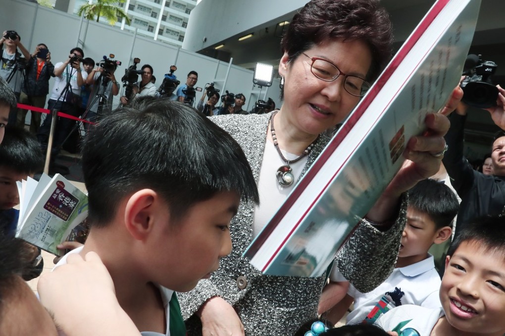 Chief Executive Carrie Lam Cheng Yuet-ngor tours the Leisure and Cultural Services Department’s “My Pop-up Library”, after the opening ceremony for the 2018 World Book Day, at a school in Sham Shui Po on April 21. Photo: Jonathan Wong