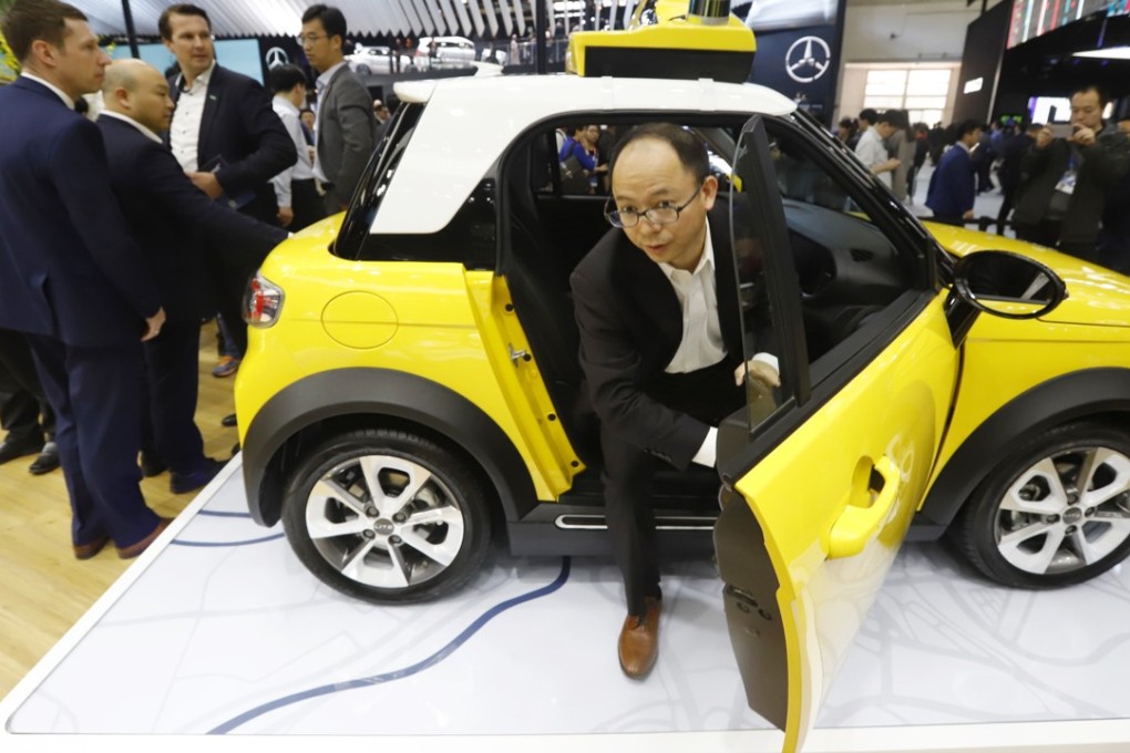 An attendee gets off from an autonomous electric car from BAIC during the China Auto 2018 show in Beijing in April this year. In the same month, China issued draft guidelines on road testing autonomous vehicles and is reviewing a final version. The technology behind self-driving cars is considered critical to the government’s plan to elevate the nation’s standing in the global auto industry. Photo: AP