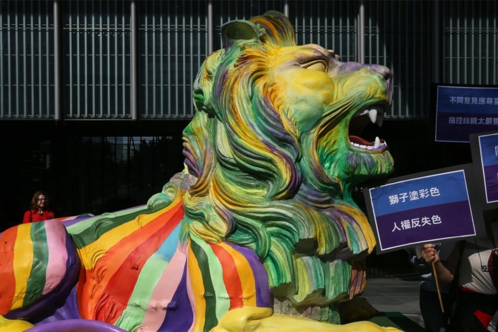 An anti-LGBTI concern group protests against HSBC’s decision to paint the iconic lion statues outside its headquarters in rainbow colours. Photo: Jonathan Wong