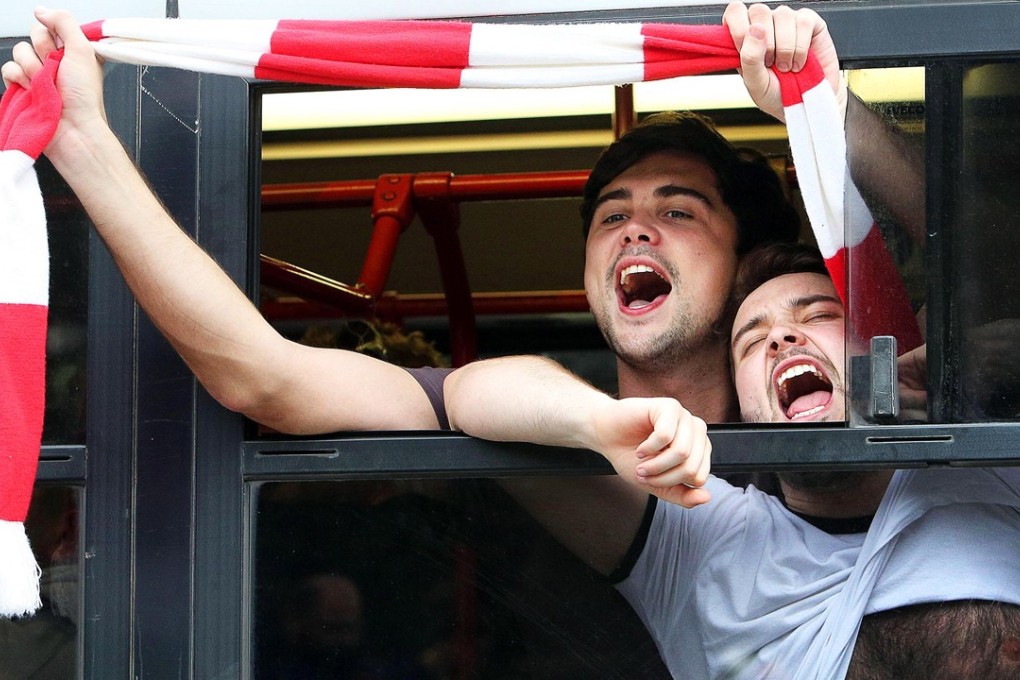 Liverpool fans board buses to the Olympic Stadium to attend the Champions League semi-final second leg against Roma. Photo: EPA
