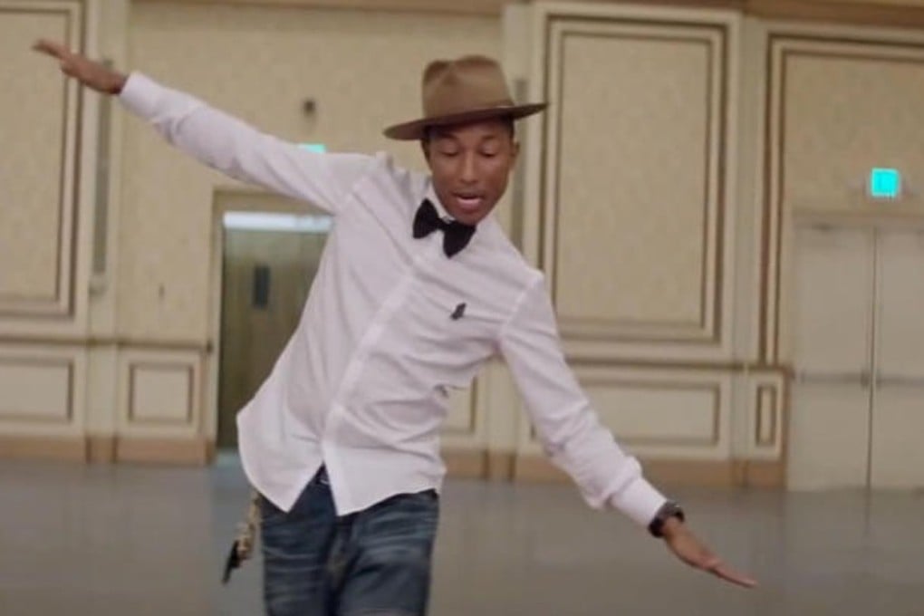 Pharrell Williams in the video for “Happy”. Photo: YouTube