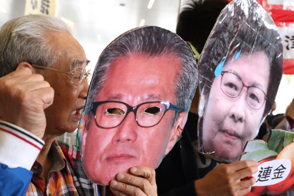 Members of the Alliance for Universal Pensions protest outside the Legislative Council before Financial Secretary Paul Chan Mo-po delivered his budget in February. The low-management-fee option of the Mandatory Provident Fund garnered worse returns than schemes with a heavy equity emphasis. Photo: K. Y. Cheng