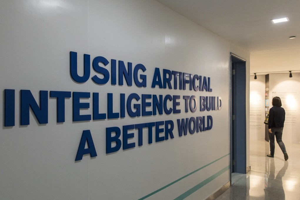 An employee walks past signage displayed inside iFlyTek’s regional headquarters in Guangzhou, China. Photo: Bloomberg