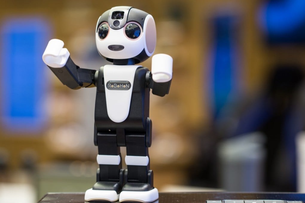 Robohon is a robot that integrates a screen, camera and projection unit all in one. It's intelligent enough to hear your voice commands to take a picture of you, project an image on the wall, and even dance if you ask it nicely. Photo by Derek Ting
