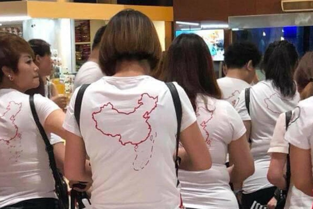 A photo of Chinese tourists wearing T-shirts embossed with the 9-dash line in the disputed South China Sea has sparked online anger in Vietnam. Photo: Twitter/Nga Pham